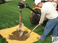 Auguring a hole in the earth for a foundation repair in Mechanicsburg 