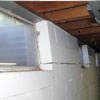 A foundation showing severe inward buckling along the windows in a Carlisle  home.