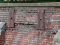 A collapsing, crumbling retaining wall in Bellefonte