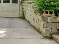 a failing retaining wall around a driveway in Reading
