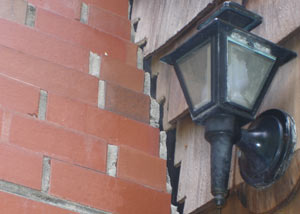 A tilting chimney in Chambersburg showing serious foundation damage.