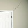 A long drywall crack beginning at the corner of a doorway in a Hazleton home.