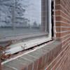 A gap in a window along the outer wall due to foundation settlement of a Williamsport home.