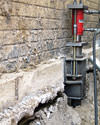 A completed installation of foundation push piers lifting a foundation in Chambersburg