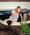 A child crawling out of an egress entryway window system in Wilkes Barre.
