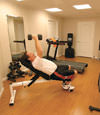 a basement gym and workout room with a wood laminate flooring, installed in Bethlehem, PA