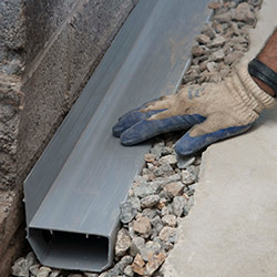 installing a drain tile system in a Kingston home